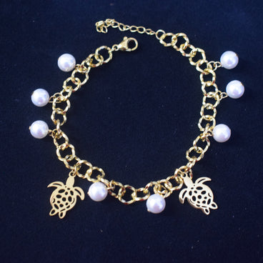 PULSERA DORADA ACERO INOXIDABLE ESLABONES CON PERLAS DIJES DE TORTUGA